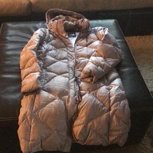 A light lavender long North Face Puff Coat